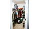 Walk-in closet with an organized arrangement of clothing and storage containers at 4406 Dickens Nw Ct, Kennesaw, GA 30144