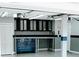 Garage features tool chests, storage cabinets and epoxy flooring at 4406 Dickens Nw Ct, Kennesaw, GA 30144