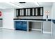 Spacious garage featuring ample storage cabinets, work bench, and tool chest to keep things organized at 4406 Dickens Nw Ct, Kennesaw, GA 30144