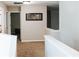 Hallway with neutral paint, carpet, and an art piece on the wall at 4406 Dickens Nw Ct, Kennesaw, GA 30144