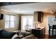 Open concept living and kitchen with island seating, granite countertops, and stainless appliances at 4406 Dickens Nw Ct, Kennesaw, GA 30144