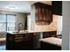 Kitchen with granite countertops, stainless steel appliances, dark cabinets, and tile backsplash at 4406 Dickens Nw Ct, Kennesaw, GA 30144