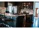 Kitchen island with stainless steel appliances and barstool seating at 4406 Dickens Nw Ct, Kennesaw, GA 30144