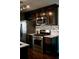 Gourmet kitchen featuring stainless steel appliances, granite countertops, and dark wood cabinets at 4406 Dickens Nw Ct, Kennesaw, GA 30144