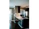 The kitchen island has bar seating, granite countertop, stainless appliances and tile backsplash at 4406 Dickens Nw Ct, Kennesaw, GA 30144