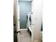 Clean laundry room with front loading washer and dryer and neutral tile floor at 4406 Dickens Nw Ct, Kennesaw, GA 30144