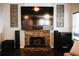Inviting living room with a stone fireplace and entertainment center at 4406 Dickens Nw Ct, Kennesaw, GA 30144