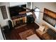 Living room features stone fireplace, flat screen TV and built-in speakers at 4406 Dickens Nw Ct, Kennesaw, GA 30144