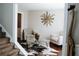 Cozy living room features neutral tones, unique art, and hardwood floors at 4406 Dickens Nw Ct, Kennesaw, GA 30144