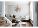 Bright living room showcasing hardwood floors, neutral decor, and a decorative wall piece at 4406 Dickens Nw Ct, Kennesaw, GA 30144