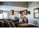 Cozy living room showcasing high ceiling and open floor plan to the kitchen at 4406 Dickens Nw Ct, Kennesaw, GA 30144