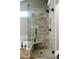 Beautiful shower features gray tile and a glass door at 4406 Dickens Nw Ct, Kennesaw, GA 30144