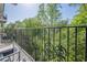 Balcony with black cast iron railing overlooking lush green foliage at 3203 Lenox Ne Rd # 32, Atlanta, GA 30324