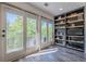 This spacious balcony area features an abundance of natural light and adjacent custom shelving at 3203 Lenox Ne Rd # 32, Atlanta, GA 30324