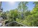 Balcony overlooking a creek and lush greenery with the building in the background at 3203 Lenox Ne Rd # 32, Atlanta, GA 30324