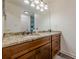 Bathroom features a granite-topped vanity with double sinks, large mirror, and brushed-nickel fixtures at 3203 Lenox Ne Rd # 32, Atlanta, GA 30324