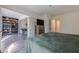 This Primary bedroom features an open floor plan with a bookcase and view into the living area at 3203 Lenox Ne Rd # 32, Atlanta, GA 30324
