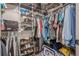 Ample storage solutions abound in this walk-in closet fitted with shelves and hanging rods at 3203 Lenox Ne Rd # 32, Atlanta, GA 30324