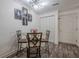 Dining area with martini-themed wall art and a glass-topped table at 3203 Lenox Ne Rd # 32, Atlanta, GA 30324