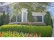 Community entrance sign with landscaping, flowers and shrubbery at 3203 Lenox Ne Rd # 32, Atlanta, GA 30324