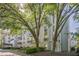 Beautiful condominium building showcasing lush landscaping and glimpses of private balconies at 3203 Lenox Ne Rd # 32, Atlanta, GA 30324