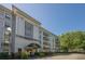 Upscale condo building features manicured landscaping and a welcoming entrance at 3203 Lenox Ne Rd # 32, Atlanta, GA 30324