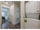 Hallway with stacked washer and dryer along with access to the main bedroom and wood-look vinyl plank flooring at 3203 Lenox Ne Rd # 32, Atlanta, GA 30324