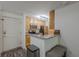 Compact kitchen showcasing granite countertops, stainless steel appliances, and a cozy breakfast bar at 3203 Lenox Ne Rd # 32, Atlanta, GA 30324