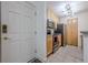 Compact kitchen featuring stainless steel appliances, granite countertops, and wood cabinets at 3203 Lenox Ne Rd # 32, Atlanta, GA 30324