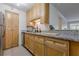 Kitchen featuring wood cabinets, granite counters, and stainless steel dishwasher at 3203 Lenox Ne Rd # 32, Atlanta, GA 30324
