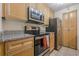 Well-lit kitchen showcases stainless appliances, granite countertops and wood cabinetry at 3203 Lenox Ne Rd # 32, Atlanta, GA 30324