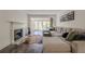 Comfortable living room features a fireplace, balcony access, a sectional sofa, and stylish decor at 3203 Lenox Ne Rd # 32, Atlanta, GA 30324