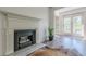 Inviting living area with decorative fireplace, wood floors, and access to a private balcony at 3203 Lenox Ne Rd # 32, Atlanta, GA 30324