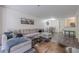 Open-concept living area features a sectional sofa, dining area, and kitchen, great for entertaining at 3203 Lenox Ne Rd # 32, Atlanta, GA 30324