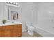 Clean bathroom with a vanity sink, white tile shower, and toilet at 3447 Dogwood Pass, Lithonia, GA 30038