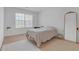 Bright bedroom with soft, natural light from a large window, and modern decorative accents at 3447 Dogwood Pass, Lithonia, GA 30038