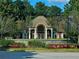 Community clubhouse featuring well manicured landscaping with stone retaining wall at 3447 Dogwood Pass, Lithonia, GA 30038