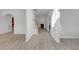 Bright entryway with hardwood floors, staircase, and views into other living spaces at 3447 Dogwood Pass, Lithonia, GA 30038