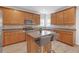 Well-equipped kitchen with wood cabinets, granite countertops, stainless appliances, and an island with seating at 3447 Dogwood Pass, Lithonia, GA 30038
