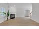 Bright living room featuring a fireplace, modern wood floors, and large windows overlooking the yard at 3447 Dogwood Pass, Lithonia, GA 30038
