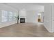 Inviting living room with a fireplace, wood floors, an open floor plan, and lots of natural light at 3447 Dogwood Pass, Lithonia, GA 30038