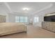 Expansive main bedroom with natural light and access to an en suite, and plenty of open floor space at 3447 Dogwood Pass, Lithonia, GA 30038