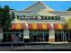 Exterior of a Panera Bread restaurant with awnings and storefront windows at 3447 Dogwood Pass, Lithonia, GA 30038