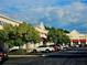 Retail stores in Stonecrest with parking in the foreground and trees at 3447 Dogwood Pass, Lithonia, GA 30038