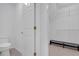Walk-in closet with wire shelving, bench and entry view of half bath at 3447 Dogwood Pass, Lithonia, GA 30038