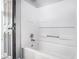 Clean, white tub and shower combination in a neutral-toned bathroom at 89 Bridge View Dr, Marietta, GA 30066