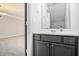 Bathroom featuring a vanity with storage and modern fixtures, next to the main bedroom at 89 Bridge View Dr, Marietta, GA 30066