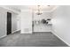 Bright dining room space with neutral paint, carpet, and modern lighting at 89 Bridge View Dr, Marietta, GA 30066