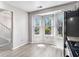 Modern eat-in kitchen featuring wood floors, bay window, and stainless steel appliances at 89 Bridge View Dr, Marietta, GA 30066