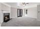 Spacious living room featuring a fireplace, neutral carpet, and glass doors leading to outdoor space at 89 Bridge View Dr, Marietta, GA 30066